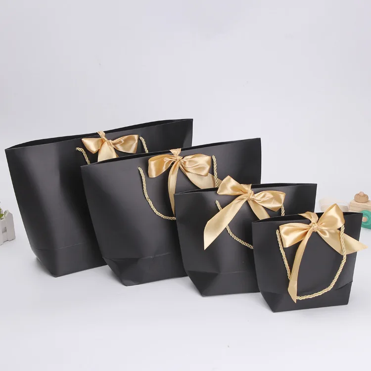 

Custom Logo Printed Fashion Cosmetics Luxury Gift Shopping Bag Custom Luxury Retail Cosmetic Paper Bag with Ribbon Knotted