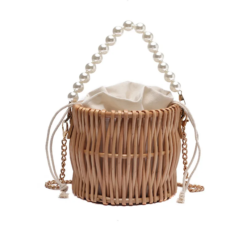 

Factory direct wholesale handmade woven beach rattan bucket bags prarl round straw hand bag, Natural