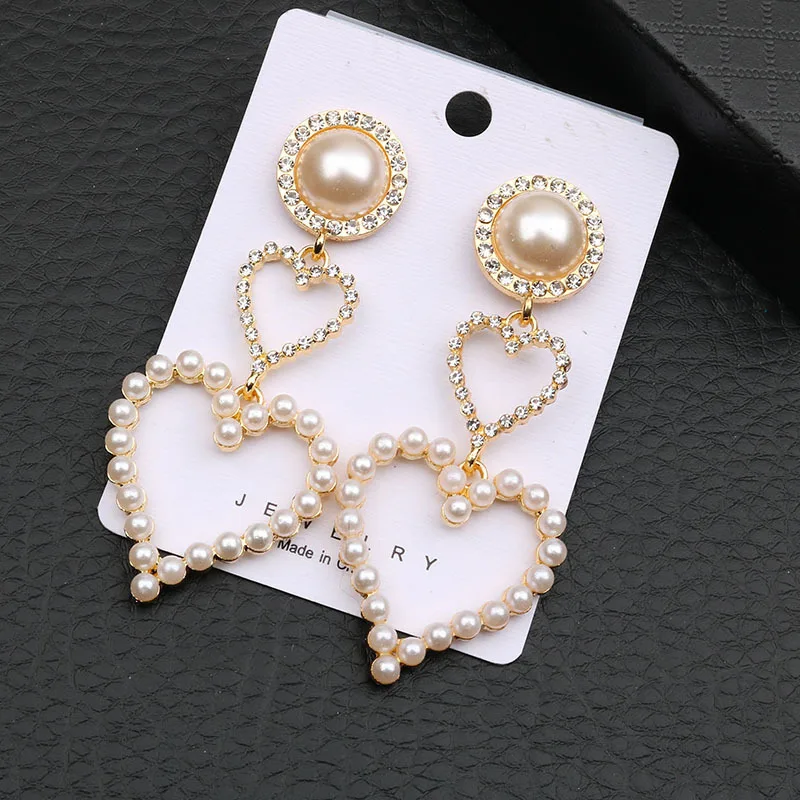 

Korean simple love pearl earrings long pendant sweet retro heart earrings drop personality hipster earrings