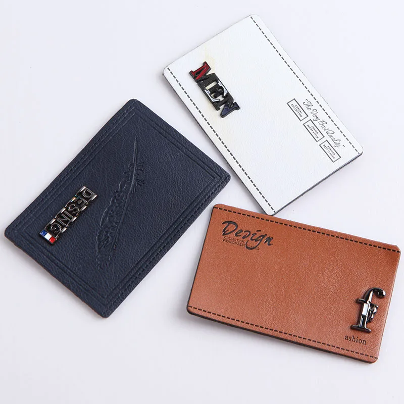 

fashion design brand name debossed logo pu labels with sewing holes, Pantone color