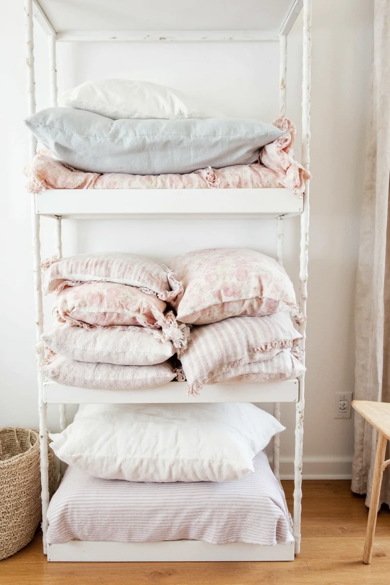 10 genius ways to store pillows in a family friendly home no more pillow pile chaos