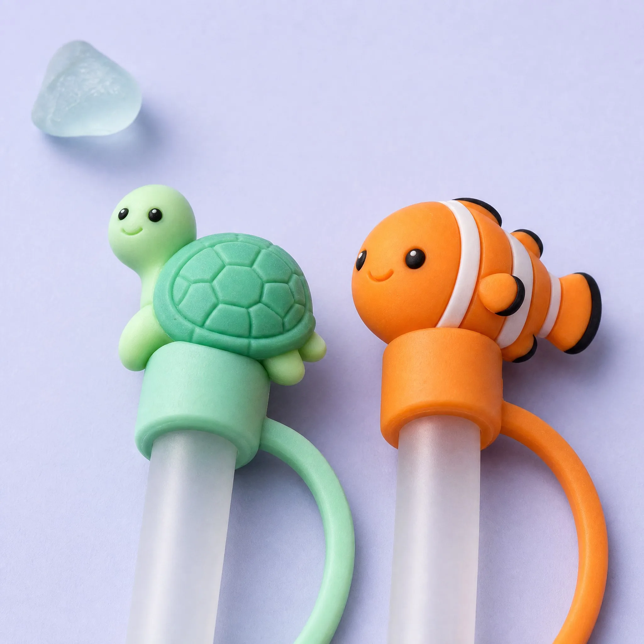 Green Sea Turtle and Orange Clownfish Straw Covers Close-up