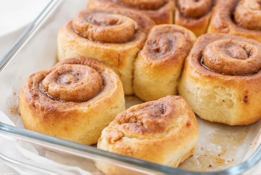 Finished cinnamon rolls with perfect glaze drizzle showing the ideal consistency and coverage
