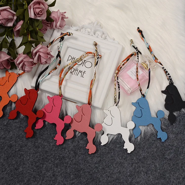 

Sheepskin Leather Dog Bag Pendant Double-sided Cowhide Handmade Platinum U Line Pony Car Female, Customized color