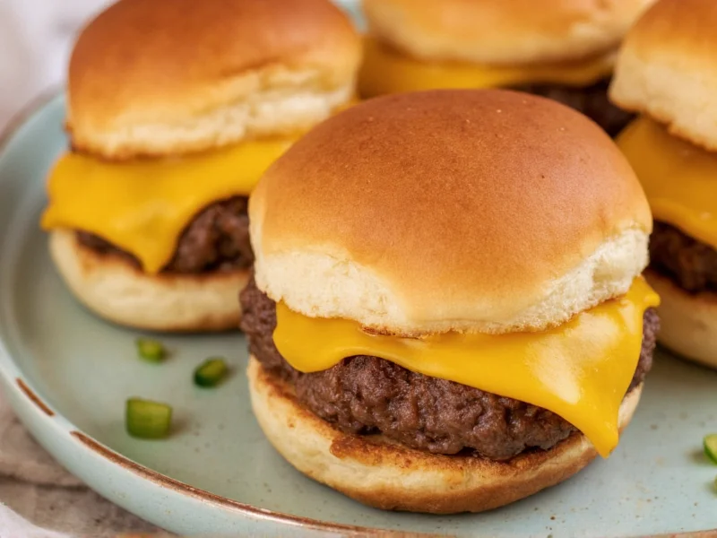Homemade sliders with melted cheese on toasted buns