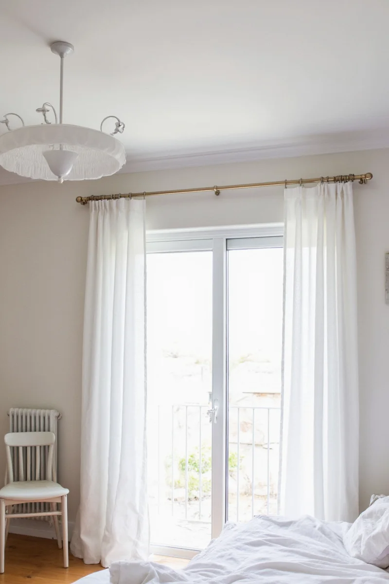 Living room with layered linen and sheer curtains