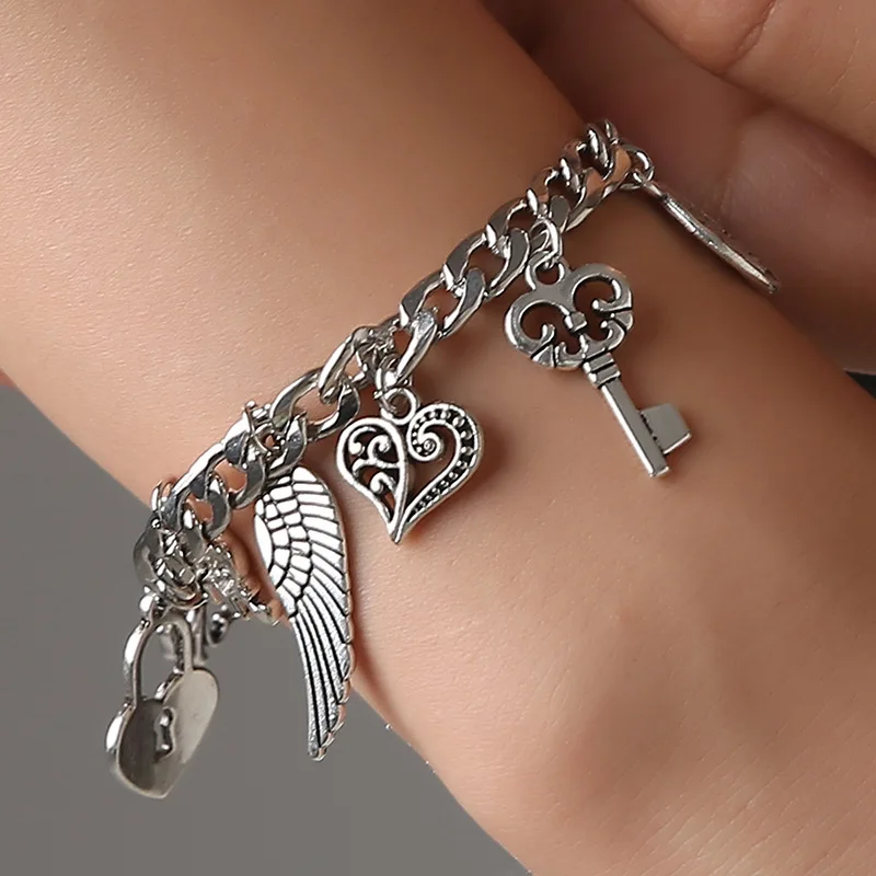 

Women nation style vintage wings pendant key heart letter elephant silver stainless steel bracelet