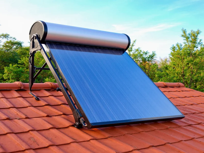 DIY solar pool heater collector mounted on south-facing roof