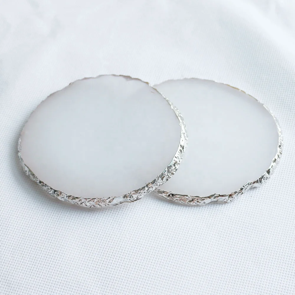 

Custom made white resin coasters with silver rim