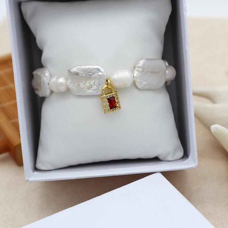 

2021 summer collection white fresh water pearl with gold plated brass and CZ lock charm pendant bracelet