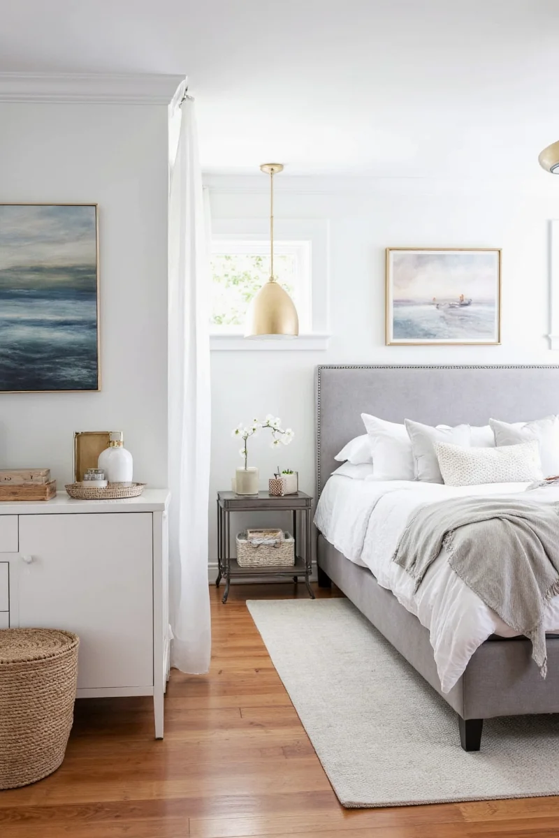 Neutral bedroom with gray bedding and white furniture