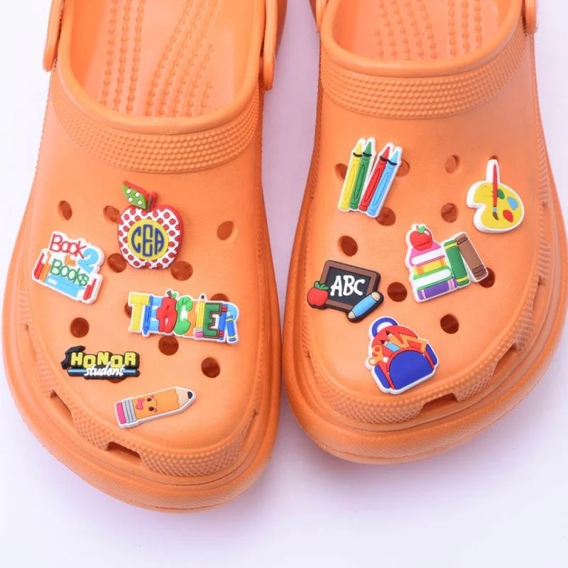 

Cheap Custom New Design Soft PVC Cartoon school/pencil/book designer Shoe Charm for kids gift Wholesale