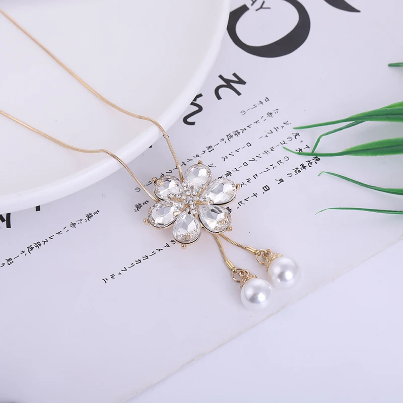 

Adjustable length fashion crystal pearl pendant necklace ladies six-petal flower sweater chain wholesale