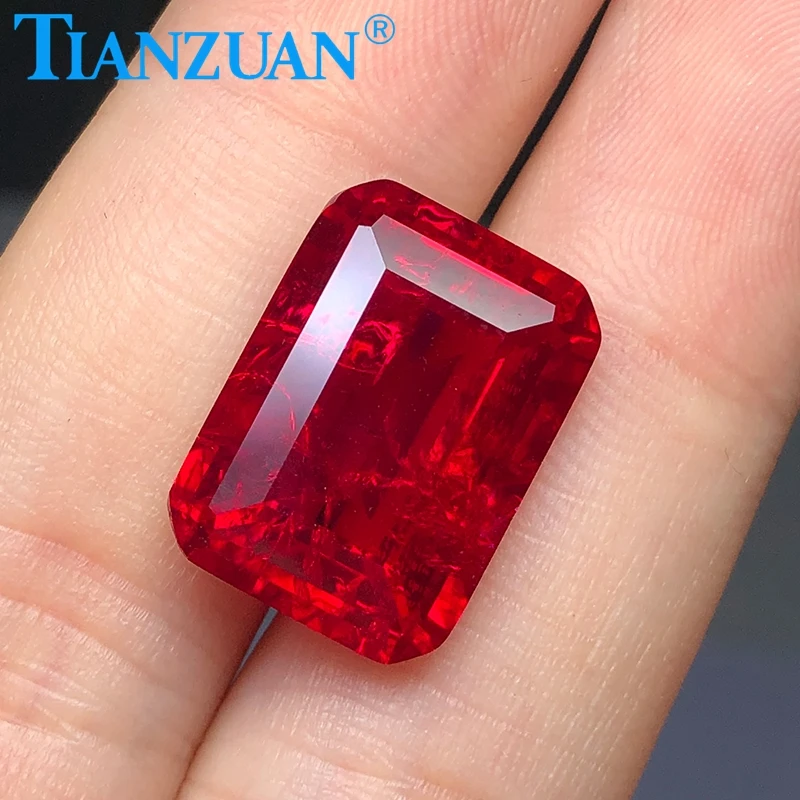 

Emerald cut ruby corundum including minor cracks and inclusions simlar to natural ruby loose gemstone, Red