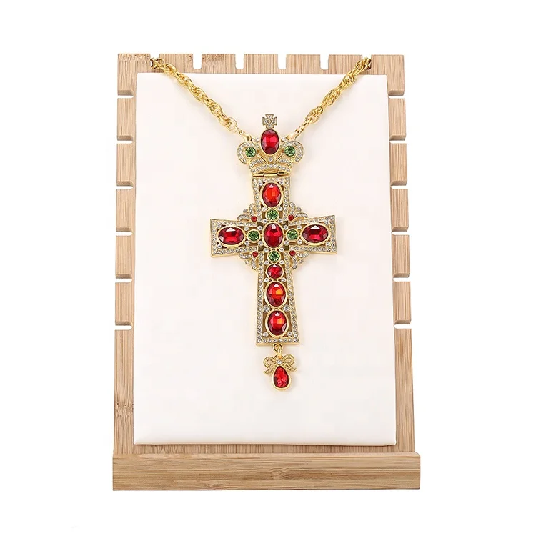 Catholic Russian Orthodox priest prays golden breast cross chain