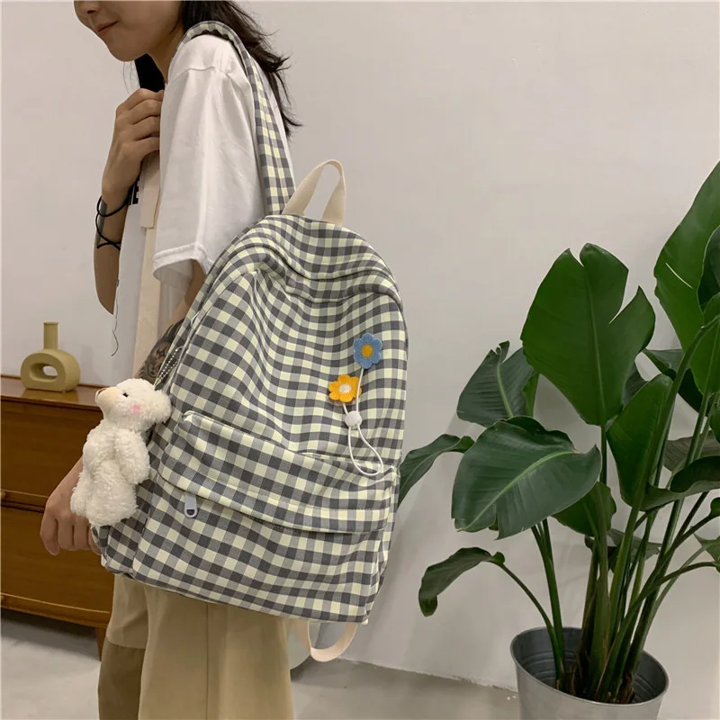 

OEM Factory Twinkle Japanese Fresh Small Plaid Soft Canvas Girl Fashion Travel Leisure Junior High School backpack Schoolbag