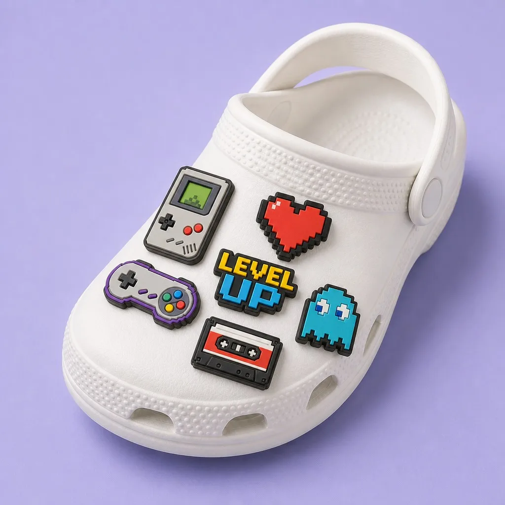 Single white clog decorated with a pixel handheld, gamepad, level badge, cassette and pixel ghost
