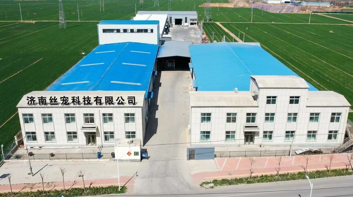 Jinan Silk Pet factory — aerial view of manufacturing facility in Jinan, Shandong, surrounded by green agricultural fields