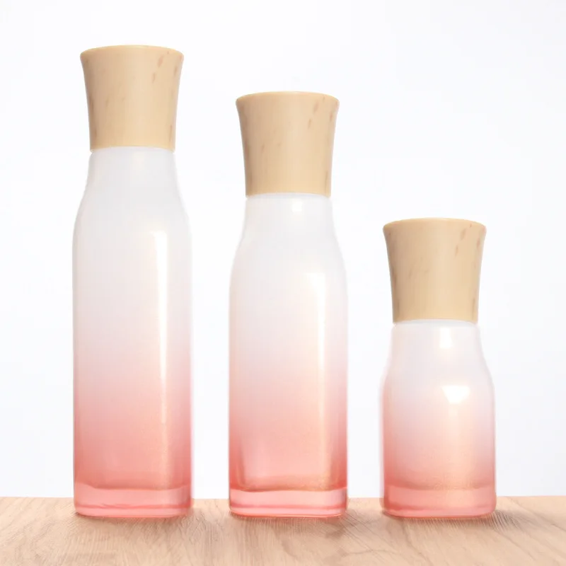 

Square 40ml 100ml glass bottle for lotion wooden lid glass cosmetic pump bottles set pink cosmetic bottles