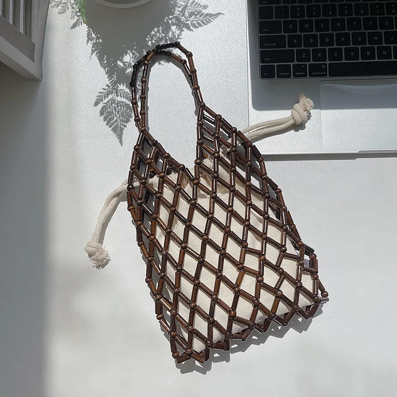 

Summer new female Korean edition trend beaded hand carried bag small number of fashion beads bag hand hollow-out woven bag