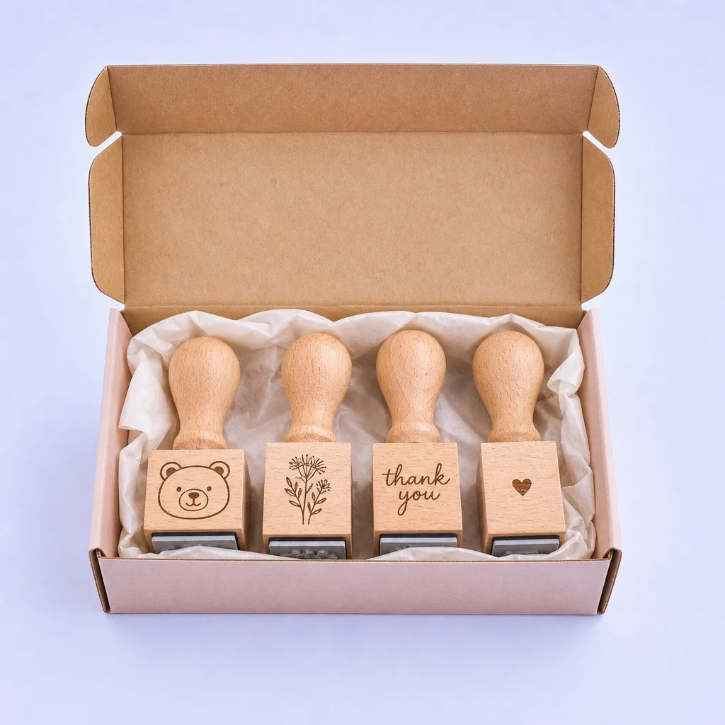 An open gift box revealing a set of journaling stamps