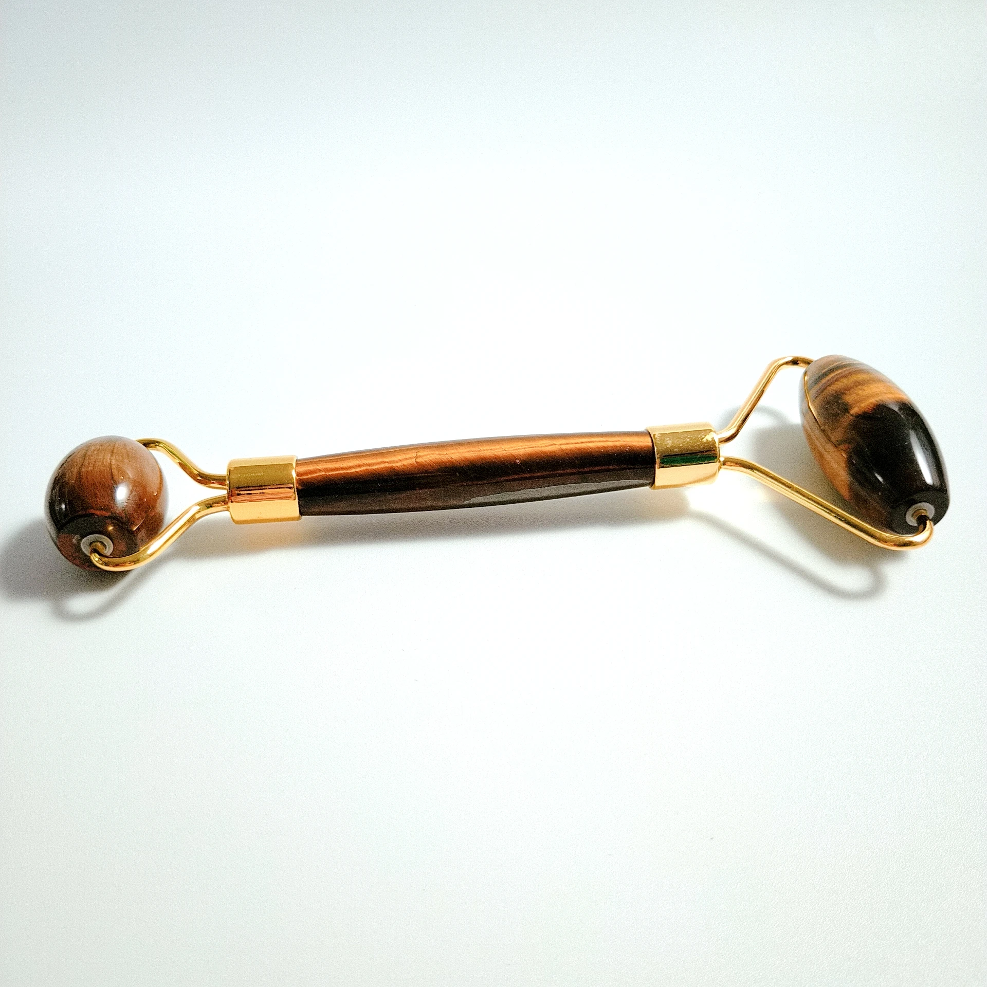 

Natural Tiger eye Facial Jade Stone Roller Face Massager Beauty Massage Tool.