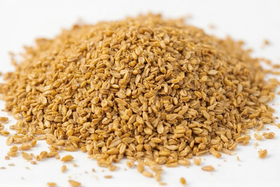 Close-up photograph of golden fenugreek seeds next to fresh fenugreek leaves showing texture contrast