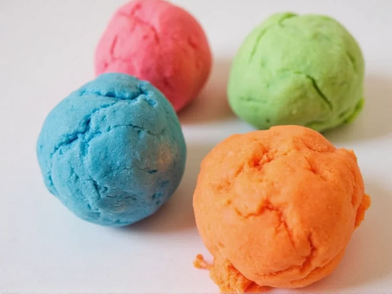 Colorful homemade playdough balls ready for sensory play activities
