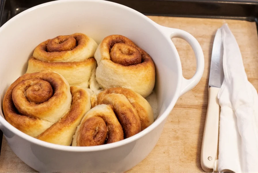 Overnight cinnamon rolls dough being rolled with cinnamon sugar filling