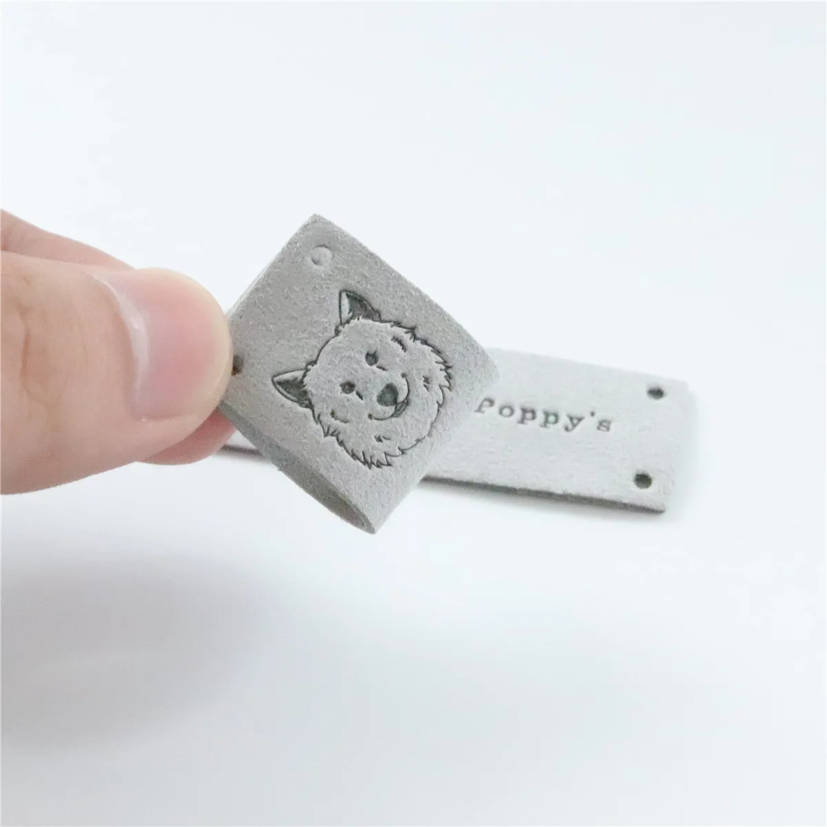 

Fashion Design Debossed suede Microfiber Leather Label for Clothing/Bags /Hat
