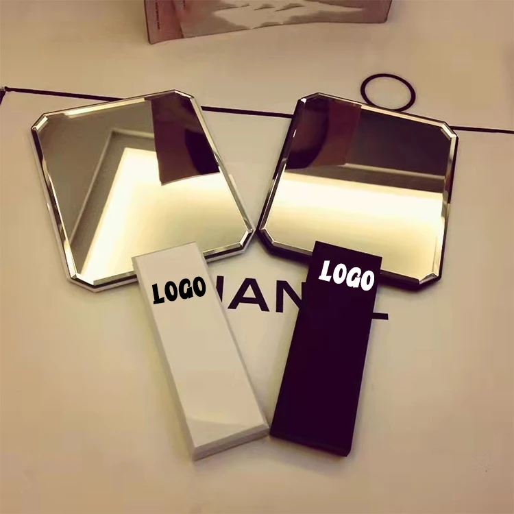 

Hand held mirror rhomb mirror