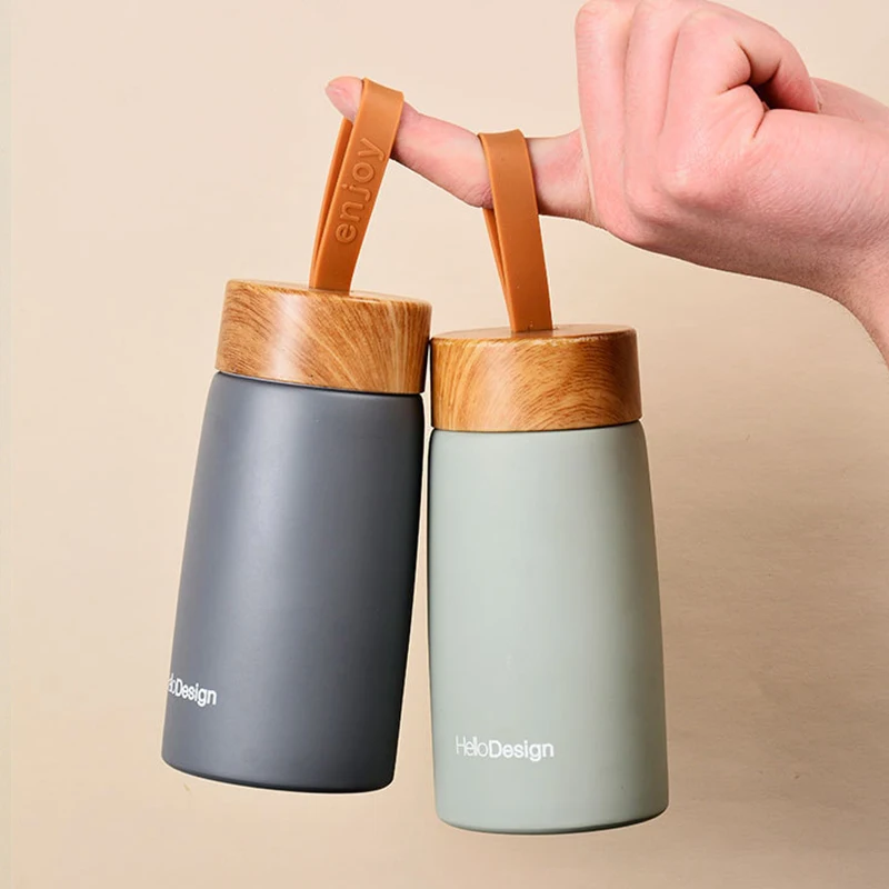 

Eco Friendly wooden grain color lid stainless steel water bottles portable insulated tea infuser water bottles