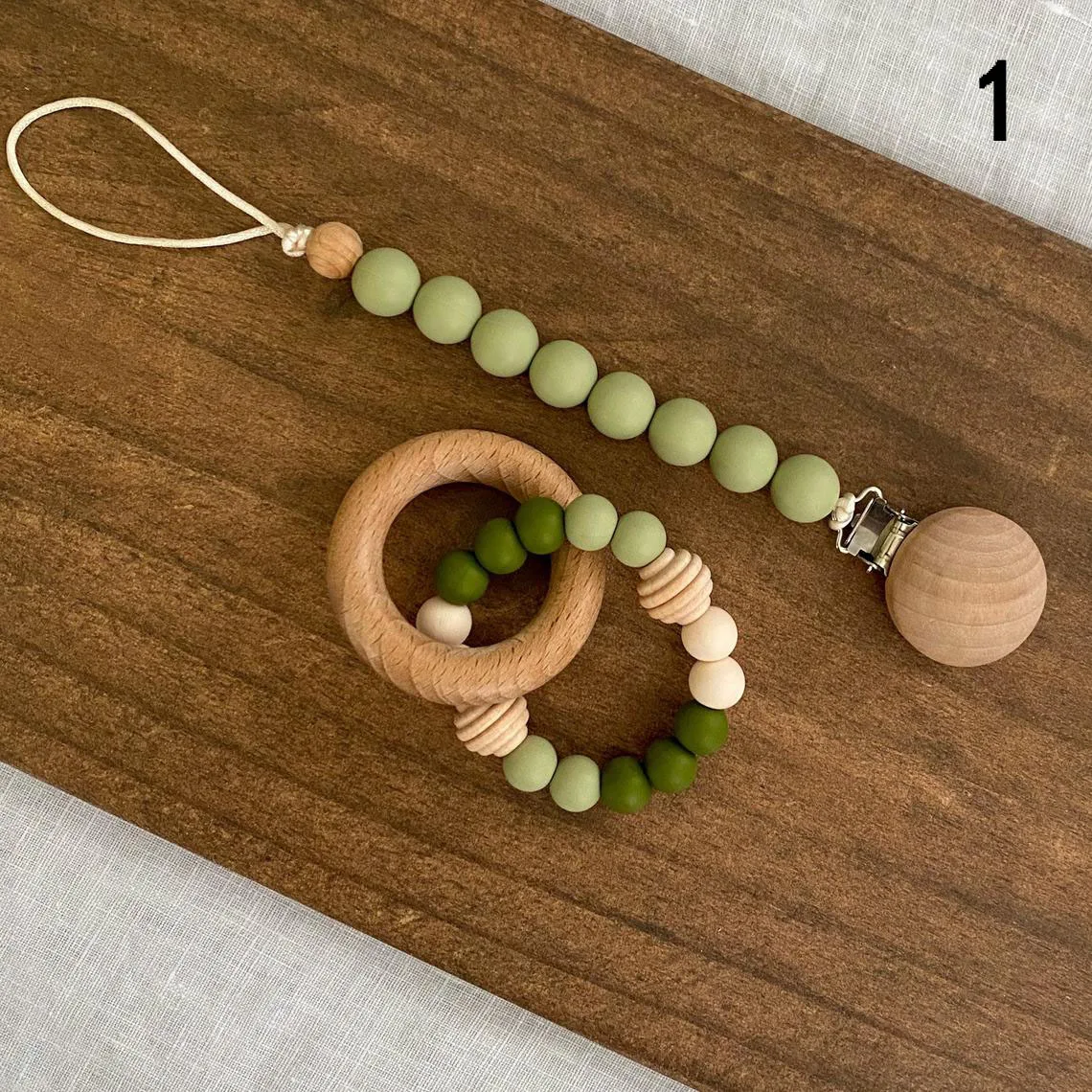 

Newborn Baby Teething Sensory Bracelet With Wooden Ring Silicone Beads Pacifier Clips