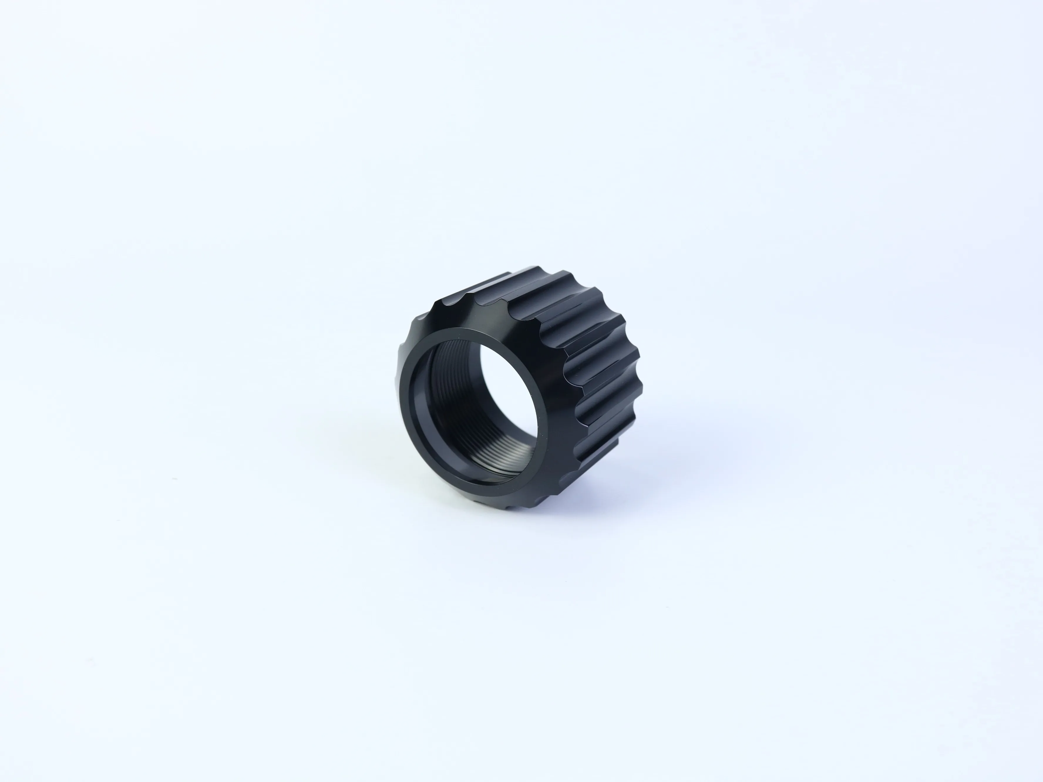 CNC machined cylindrical ring with internal threading and external grip grooves