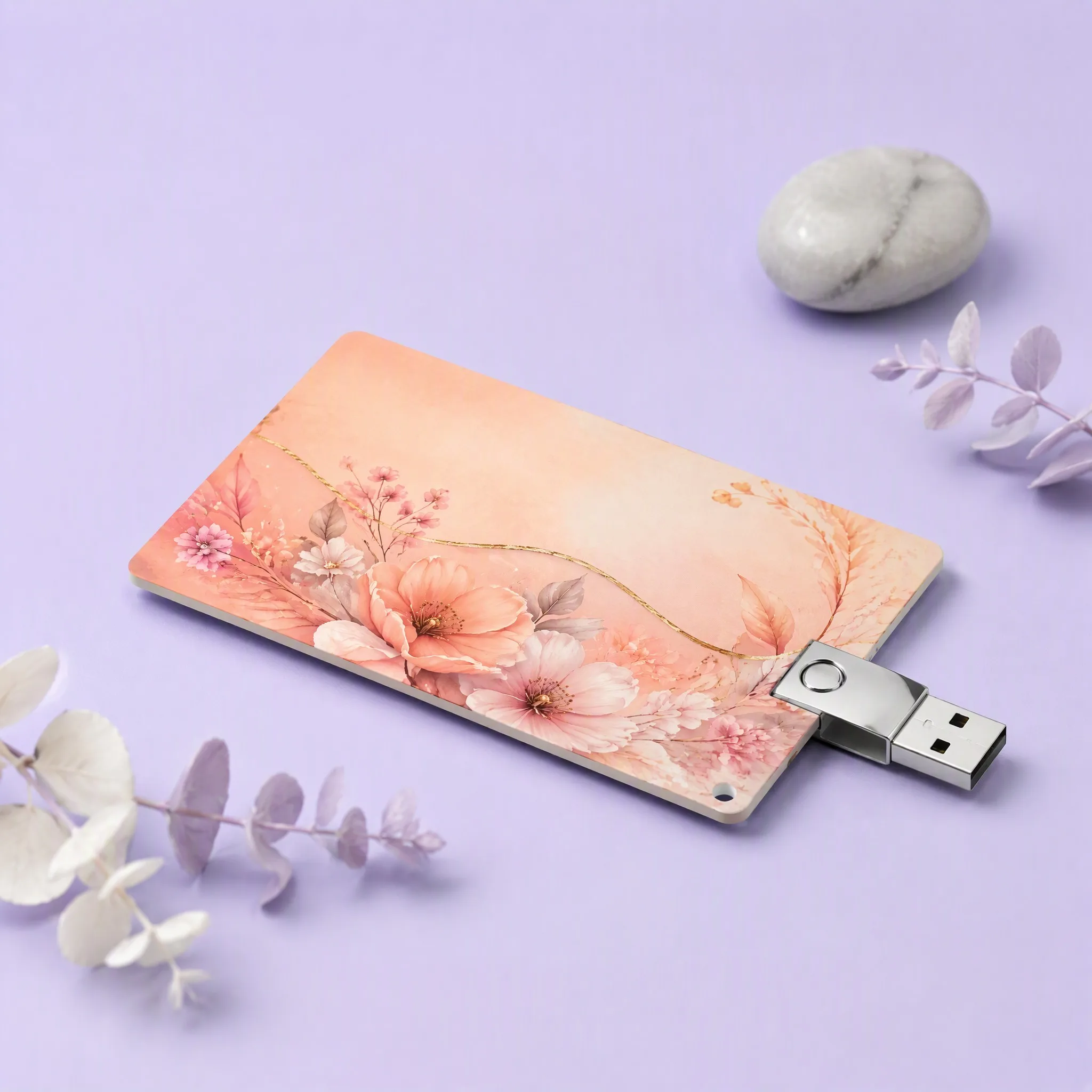 Aesthetic Studio Still Life Flat-Lay with Dried Purple Eucalyptus, White Flowers, River Stone, and Peach Card USB Drive