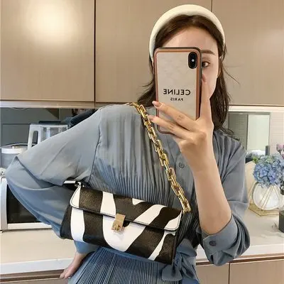 

2021 Italy new design hot-selling diamond lattice chain armpit luxury cow zebra pattern crossbody women hand bags