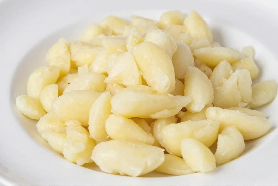 Close-up of minced garlic in measuring teaspoon