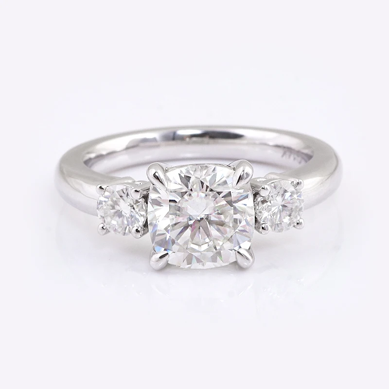 

Typical 3 stones engagement ring in 14k white gold with 2 carat weight cushion cut moissanite DEF-VVS