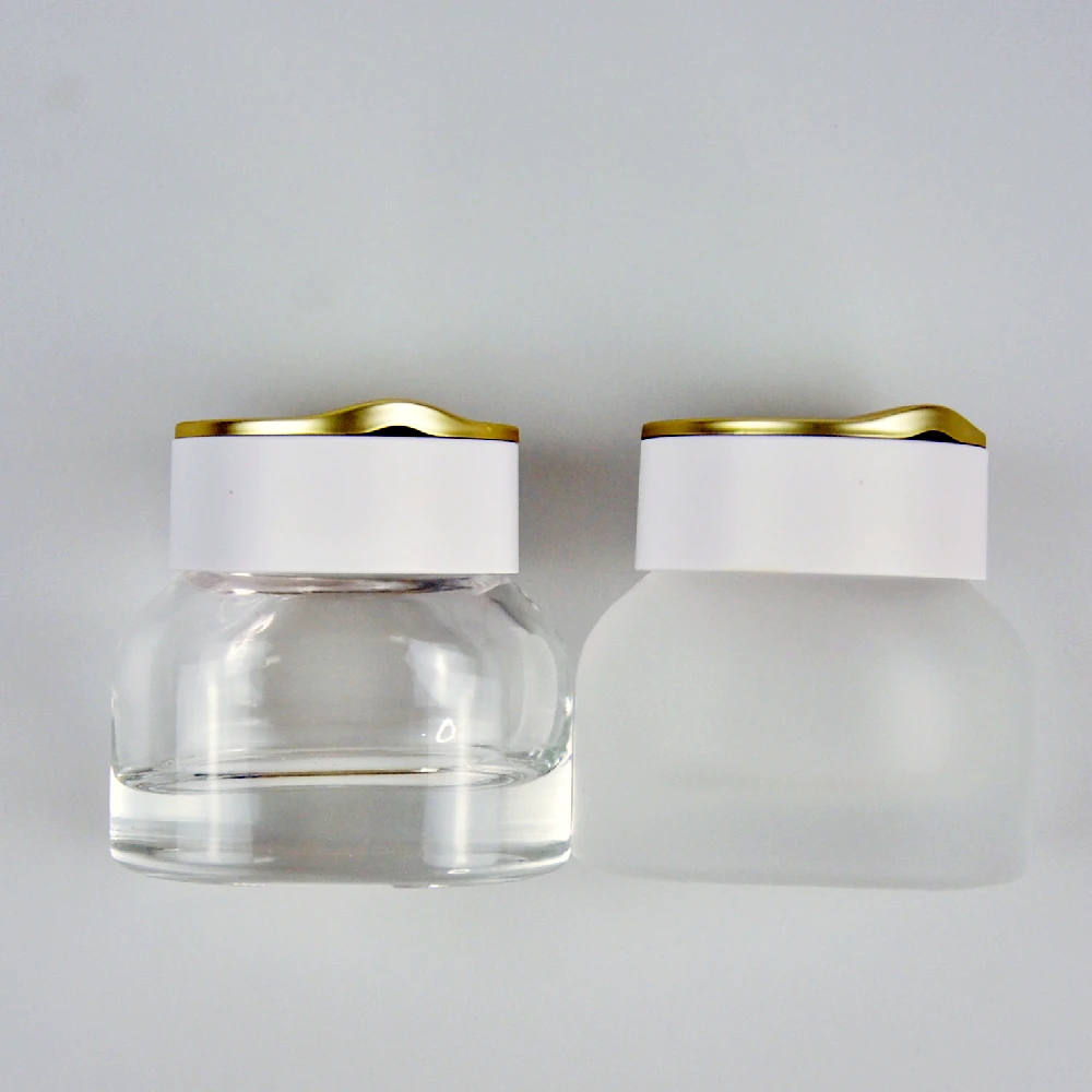 

Super September Special Design 30g 50g 40ml 100ml 120ml Flat Round Transparent Frosted Glass Face Cream Jars with White Gold Lid