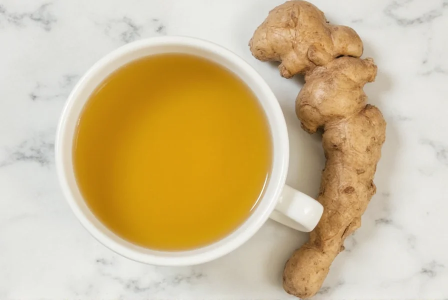 Fresh ginger root slices boiling in a small pot of water with steam rising