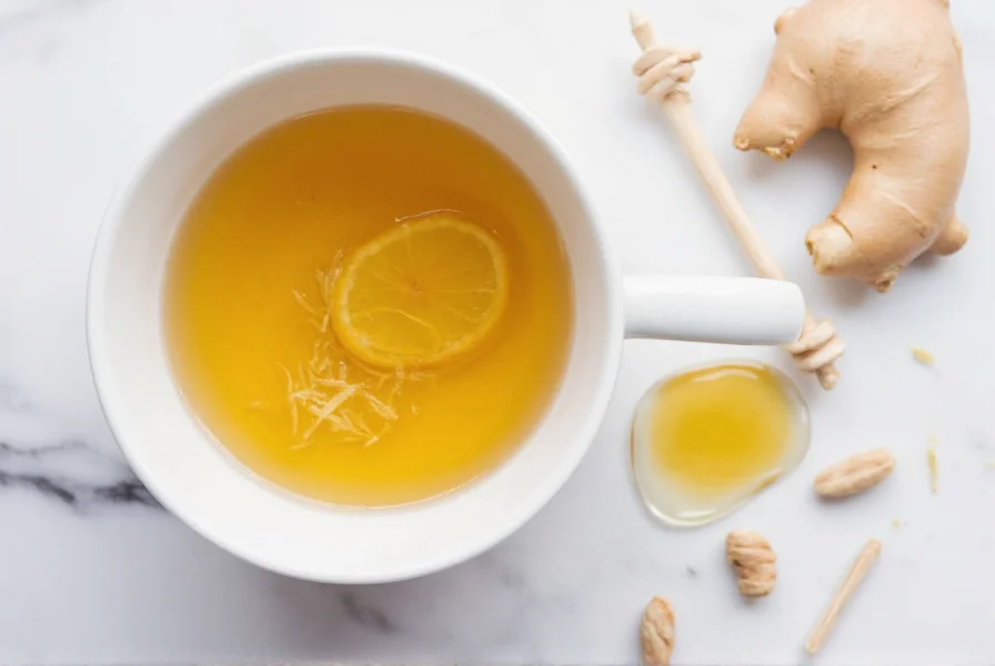 Ginger tea preparation showing grated ginger in teacup with lemon slice and honey