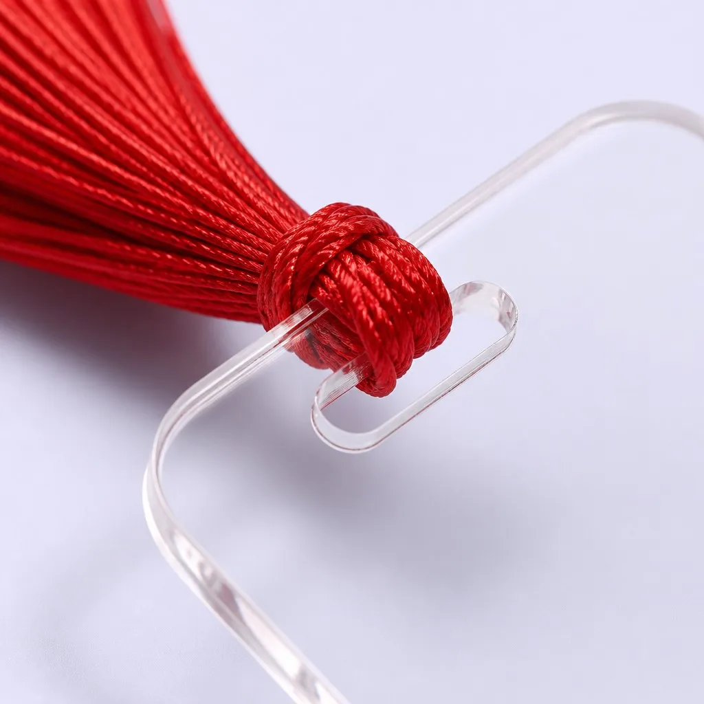 Top aperture and hand-tied red silk tassel knot close-up