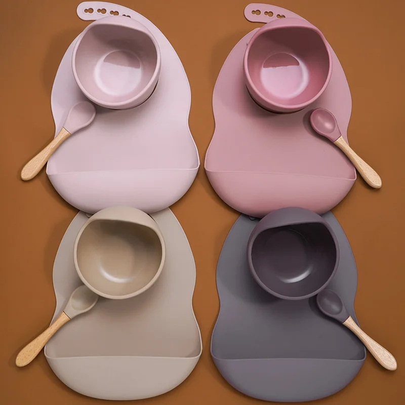 

Hot Selling BPA Free Silicone Baby Suction Bowl Easily Clean Baby Bibs Soft Silicone Spoon With Wooden handle