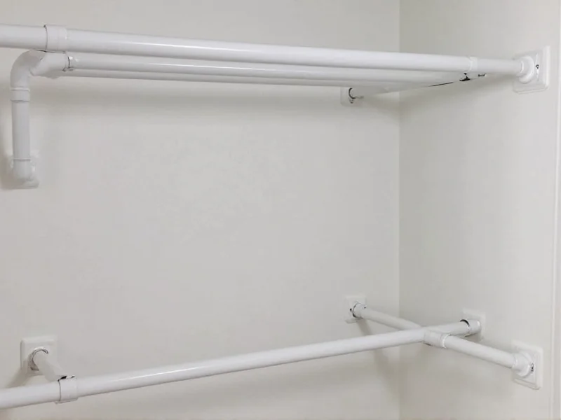PVC pipe closet organizer with adjustable hanging rods
