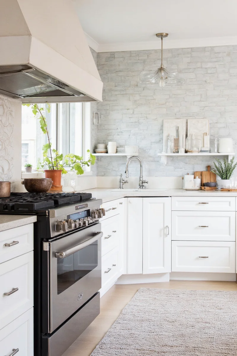 Modern open kitchen shelving with decorative touches