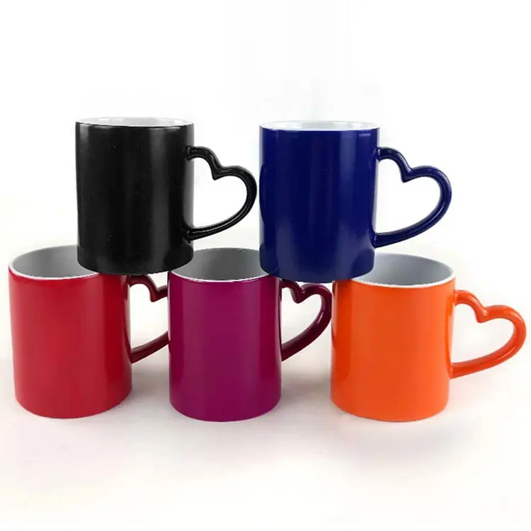 

2021 trend sublimation heart handle mugs heat transfer Ceramic mug ceramic colorful changing color cup wholesale, Customized color acceptable
