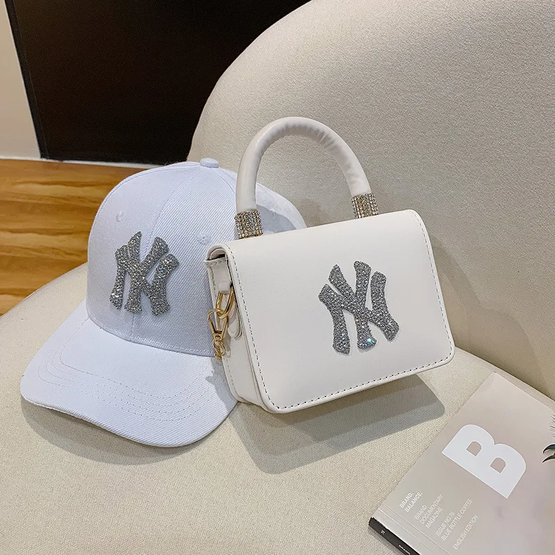 

2021 Hot selling Branded Famous Designer Diamond New York PU Shoulder Handbags Women Spring Summer Rhinestone NY Purses and hat, Accept customized