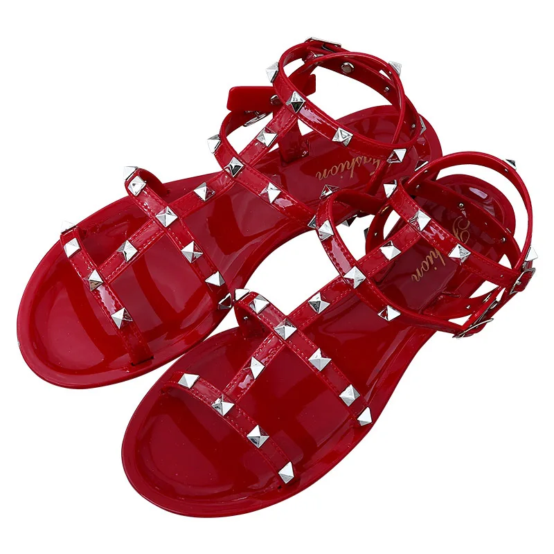 

2021 Wholesale summer trend cheap ladies plastic studded rivet crystal flat jelly gladiator strappy sandals for women