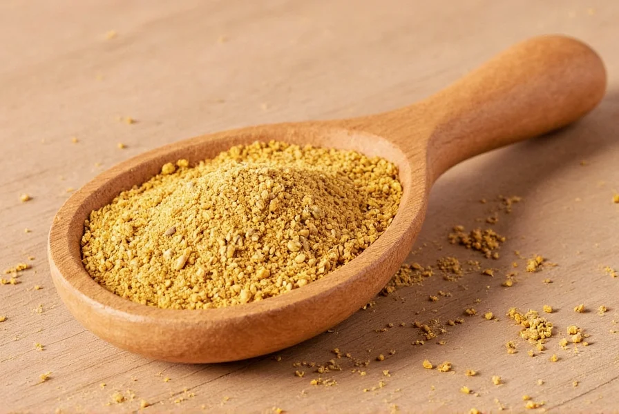 Close-up view of golden-brown fenugreek seed powder in a glass container with measuring spoon
