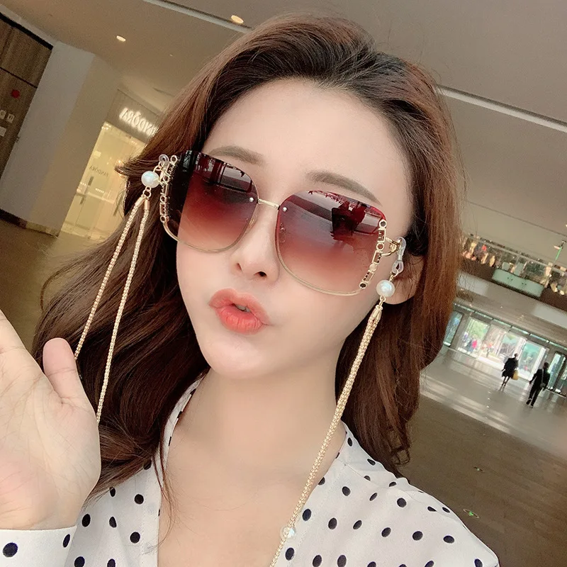 

Hot Selling Women Frameless Sun Glasses Wholesale 2020 New Arrivals Stylish Sunglasses With Chain